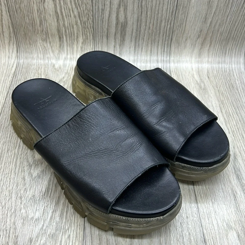 Aquatalia black leather slides with clear lug sole rubber outsole